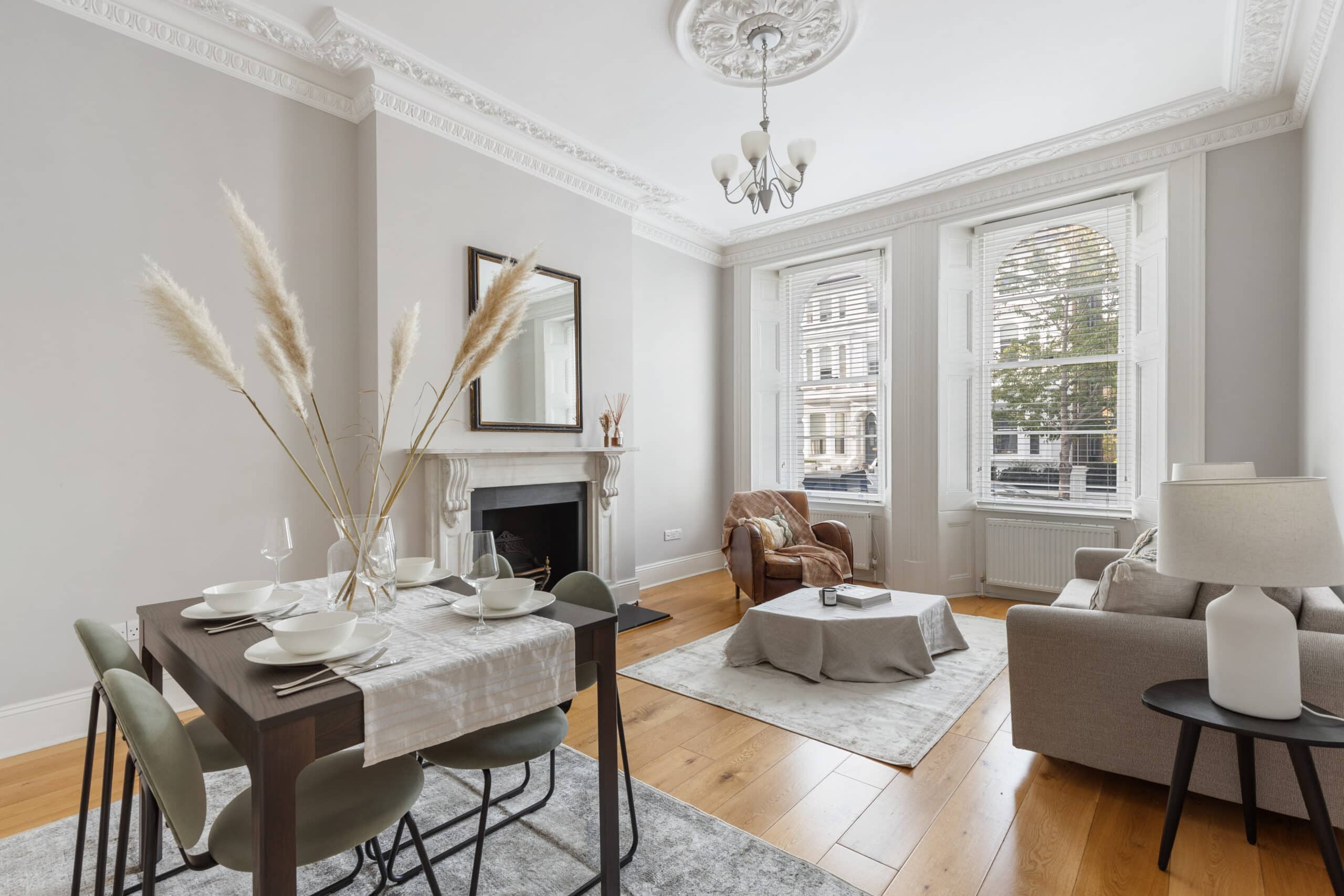 Bright living and dining area with large windows at Elgin Crescent
